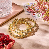 Armband BIBA - Goudkleurige  Bolletjes gestreept/